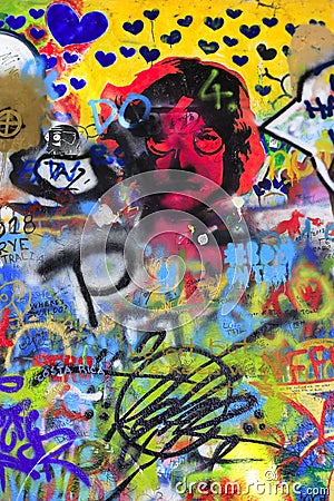 Detail of the famous John Lennon`s wall with graffiti in Prague Editorial Stock Photo