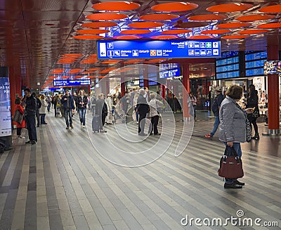 Prague, Czech Republic, March 23, 2019: Travellers people waiting on a train in departure hall and looking on a Editorial Stock Photo