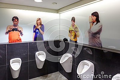 Prague, Czech Republic, March 23, 2012. Urinals in a public men`s toilet in a shopping mall in Prague Editorial Stock Photo