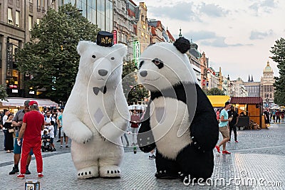 Prague, Czech Republic - May 26, 2018: Men dancing in a Polar bear and Panda bear fancy dress costumes entertains a crowd of Editorial Stock Photo