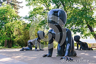 PRAGUE, CZECH REPUBLIC - MAY 2017: Three big bronze baby sculptures by Czech artist David Cerny. Park on the Kampa Island in Pragu Editorial Stock Photo