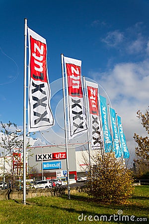 XXXLutz Mobelix corporation logo on supermarket building Editorial Stock Photo