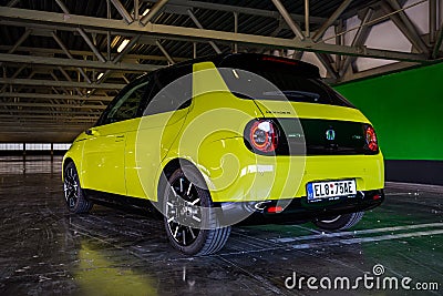 Prague, Czech republic - October 02, 2020. Yellow green electric Honda E parked in industrial parking spot - back view Editorial Stock Photo