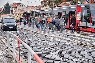 Prague, Czechia - Oct 26, 2018. People catching a tram in the center of Prague Editorial Stock Photo