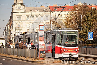 Prague tram, or called Prazske tramvaje, Tatra KT8D5 model, on Palackeho Namesti, crowded with commuters Editorial Stock Photo