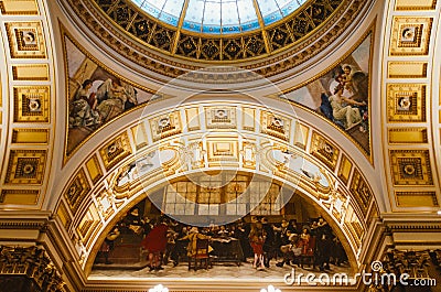 Prague, Czechia - A vertical shot of the interior of The National Museum and its main hall with the predominant use of gold to Editorial Stock Photo