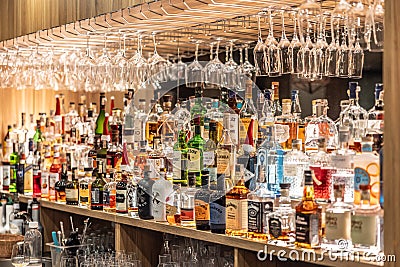 Prague - December. 12, 2023: Bottles of whiskey rum and other spirits in the restaurant bar. A large assortment of alcoholic Editorial Stock Photo