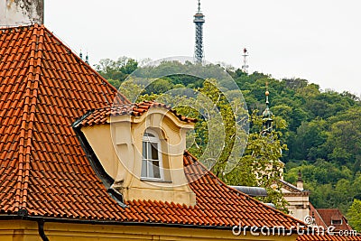 Prague. 05.10.2019: Low light detail of patina red roof top. Prague Lesser Town typical roofing material. Old roofing of clay Editorial Stock Photo