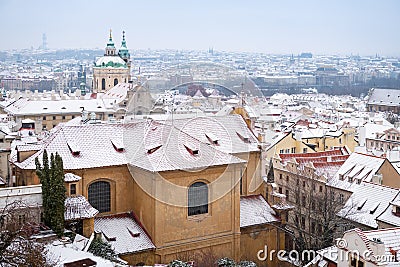 Prague roofs covered with fresh snow Stock Photo