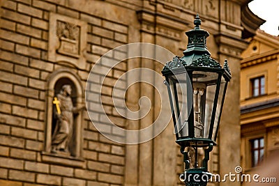 Prague. 05.10.2019: Prague street lamp. Wrought iron flashlight on the background wall of an ancient building Editorial Stock Photo