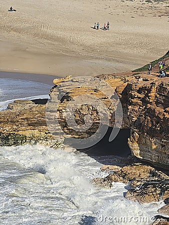 View of a Sea Cave at Praia do Norte (North Beach) in Nazaré, Portugal Stock Photo