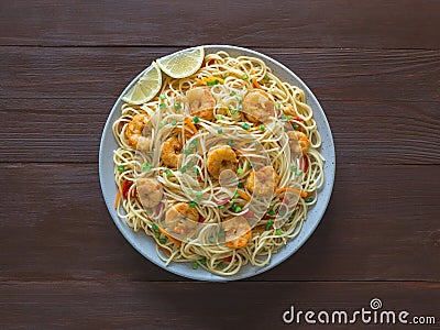 Prawn Schezwan Noodles with vegetables in a plate Stock Photo