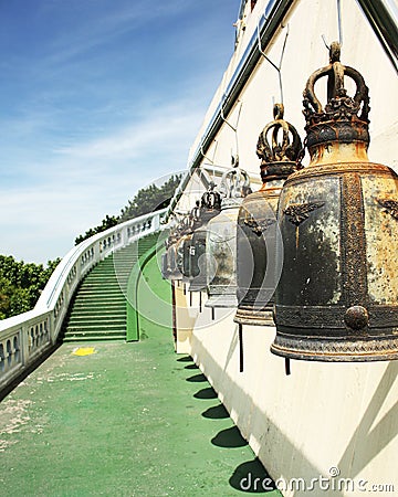 Prayer bells along pathway and staircase. Stock Photo