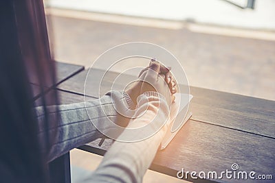 Prayer and bible concept. Asian female praying, hope for peace and free from coronavirus, Hand in hand together by woman, believes Stock Photo