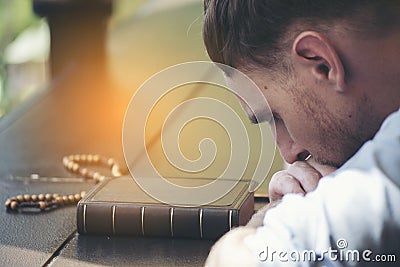 Prayer and bible concept. Caucasian man praying, hope for peace the world and free from coronavirus, Hand in hand together, Stock Photo