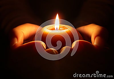 Prayer - candle in hands Stock Photo