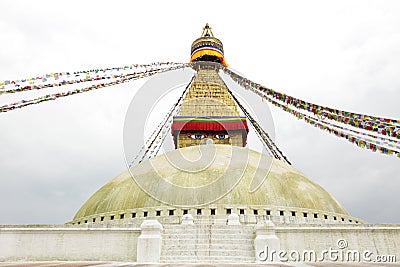 Prayer flags and main shrine of the Swayambhunath Stupa Stock Photo