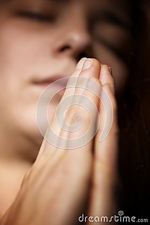 Prayer with folded hands Stock Photo