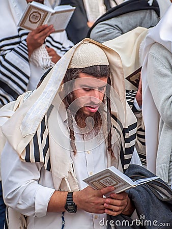 Prayer. Hasids pilgrims in traditional clothes. Rosh-ha-Shana festival, Jewish New Year. Editorial Stock Photo