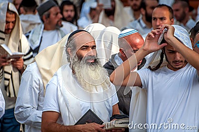 Prayer. Hasids pilgrims in traditional clothes. Rosh-ha-Shana festival, Jewish New Year. Editorial Stock Photo