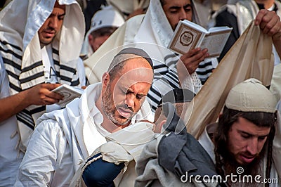 Prayer. Hasids pilgrims in traditional clothes. Rosh-ha-Shana festival, Jewish New Year. Editorial Stock Photo