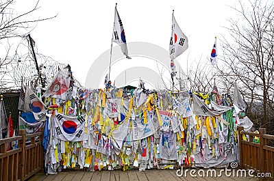 Prayer ribbons tied to the fence Editorial Stock Photo