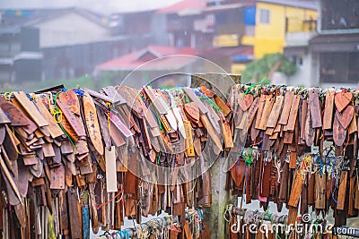 Prayer tags tied on the bridge in the Pilok mine village in kanchanaburi City Thailand. Editorial Stock Photo