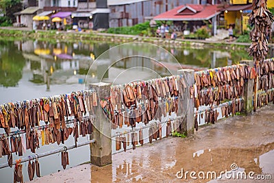 Prayer tags tied on the bridge in the Pilok mine village in kanchanaburi City Thailand Editorial Stock Photo