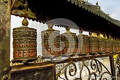 Prayer wheel in Nepali near the Buddhist temple Stock Photo