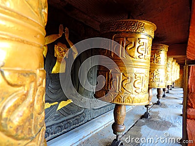 Prayer wheel with painting at Chimi Lhakhang, Bhutan Stock Photo