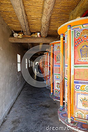 Prayer wheel in Tibetan Buddhist monastery Arou Da Temple in Qinghai China Editorial Stock Photo