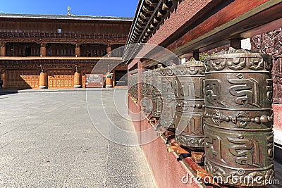 Prayer wheels in a tibetan temple of ShuHe Old Town, a Unesco World Eritage Site not far from Lijiang Old Town Editorial Stock Photo