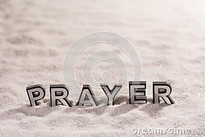 Prayer word on white sand Stock Photo