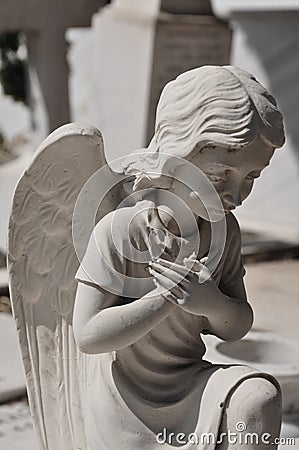 Praying angel statue Stock Photo