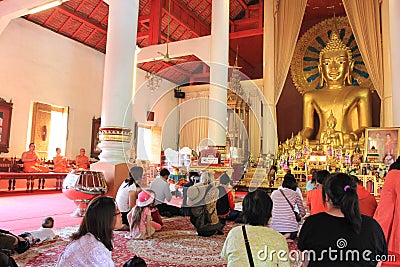 Praying at a buddist temple Editorial Stock Photo
