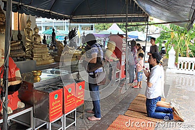 Praying at a chineese buddhist temple of Golden Buddha, Wat Traimit Editorial Stock Photo
