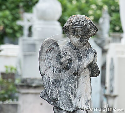 Praying concrete angel cemetery Stock Photo