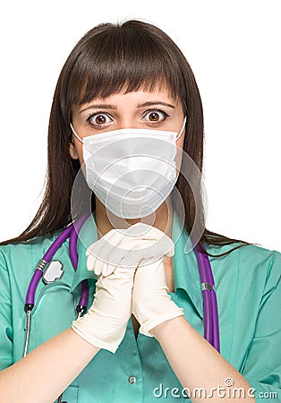 Praying female medical doctor with mask isolated Stock Photo