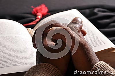 Praying hands bible Stock Photo