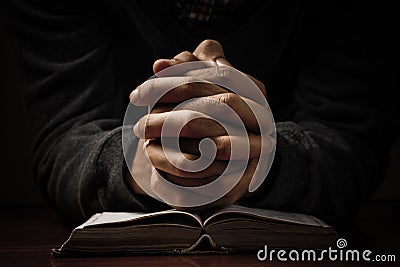 Praying Hands With Bible Stock Photo