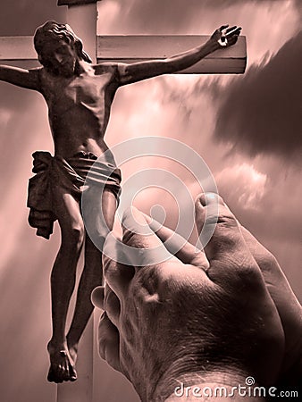 Praying hands with cross Stock Photo