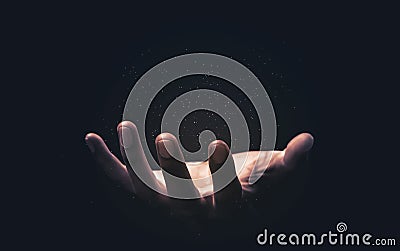 Praying hands with faith in religion and belief in God on blessing background. Power of hope or love and devotion. Magic powder Stock Photo