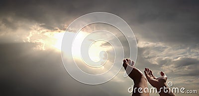 praying hands of a man for blessings his god on the sunset Stock Photo