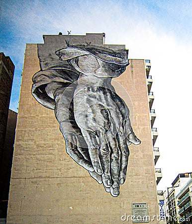 Praying Hands Street Art On Side of Building in Athens, Greece Editorial Stock Photo