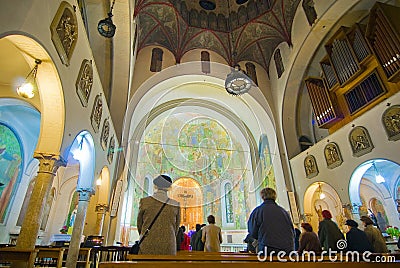 Praying inside Catholic church Stock Photo