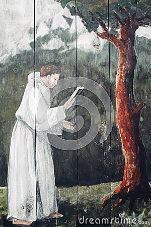 Praying monk A picture painted on a wooden board Editorial Stock Photo