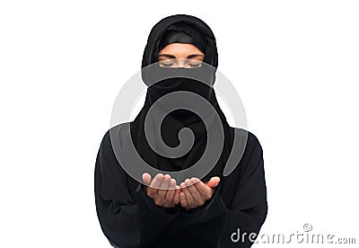 Praying muslim woman in hijab over white Stock Photo