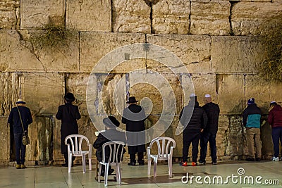 praying people at the western wall in the evening Jerusalem travel Editorial Stock Photo