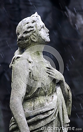 Praying in the Rain Stock Photo