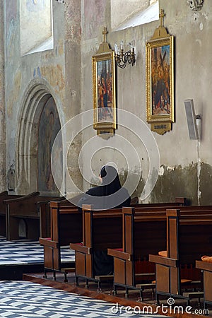 Praying sister inside church Editorial Stock Photo